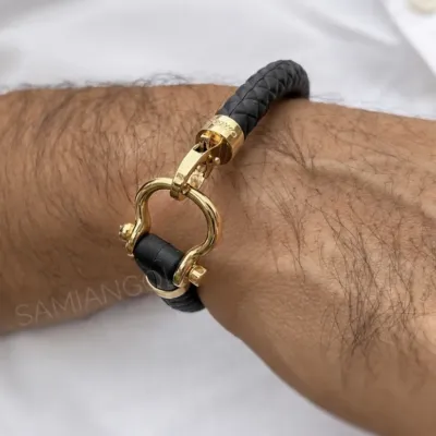 دستبند امگا طلایی بند رابر مشکی
