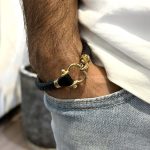 دستبند امگا طلایی بند رابر مشکی